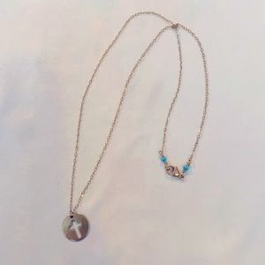 Gold cross necklace with turquoise stones accent